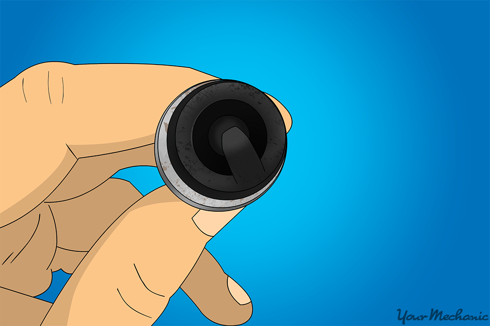 Step 2 Check for soot. When you first begin to examine a spark plug